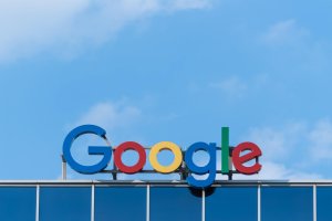 Google sign against blue sky.